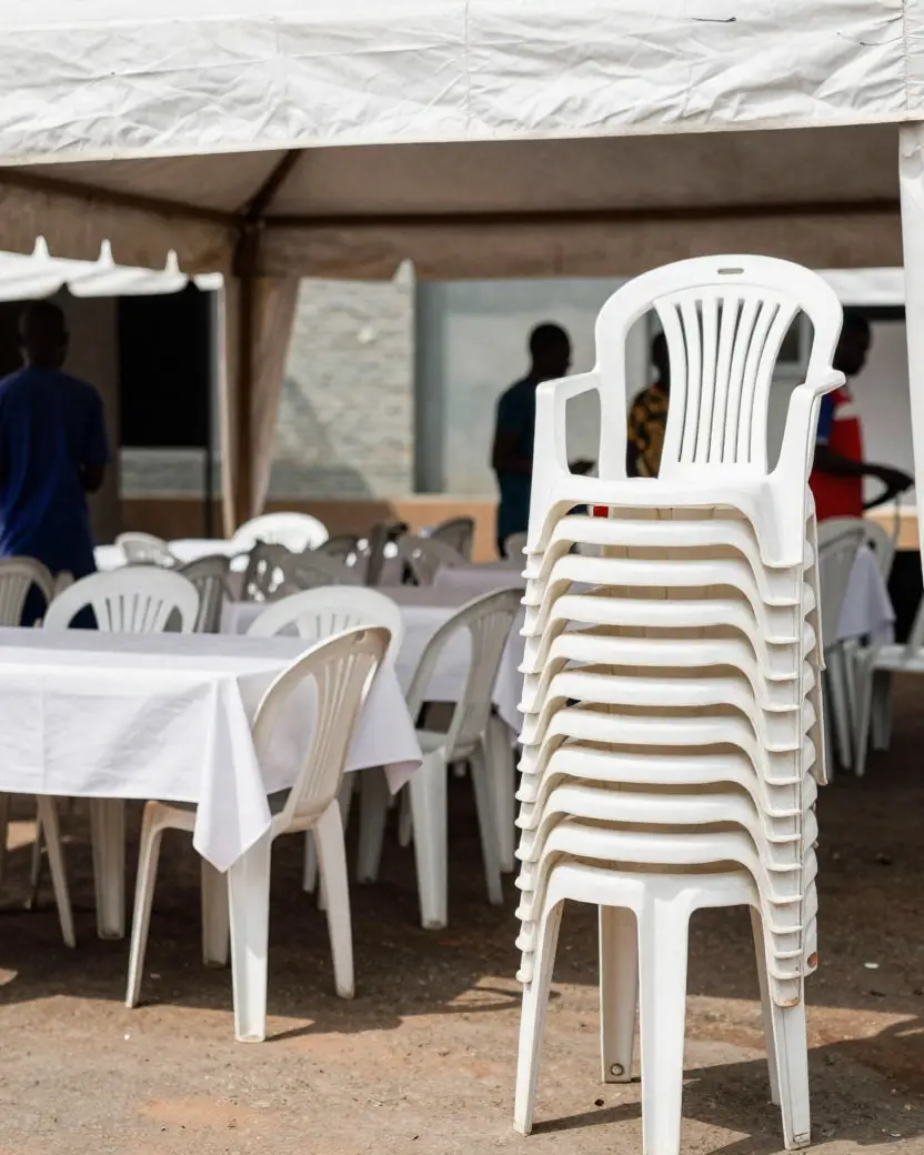Chairs set out under a canopy